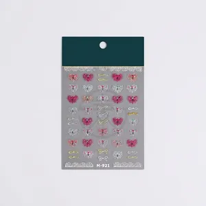 3D embossed ribbon bow nail art stickers with metallic finish on a display card