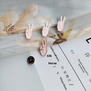 Set of four cute Japanese style pink V-sign enamel pins with gold metal outlines