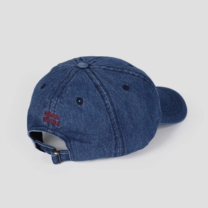 Detail view of denim baseball cap with red Urban Aurora embroidery and adjustable metal buckle