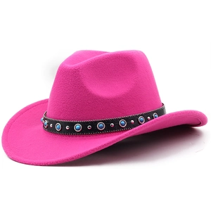 Detail of hot pink cowboy hat featuring black leather band with turquoise beads