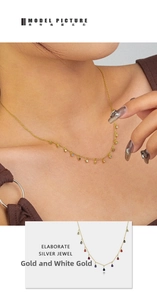 Detailed view of 925 sterling silver clavicle chain with colorful zircon tassels