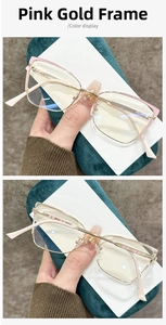 Detail view of stylish pink gold metal eyeframe with a subtle cat-eye design