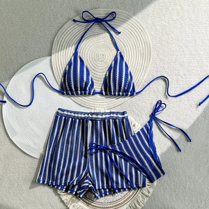 Three-piece blue striped bikini set with halter top and matching knit shorts for summer