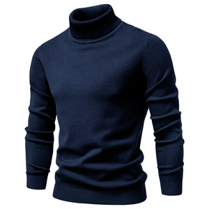 Detail view of the ribbed turtleneck and navy blue knit texture on this men's sweater