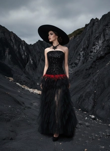Detail of black sequined corset dress with red feather waist and layered tulle skirt