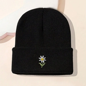 Classic black knitted beanie with a delicate daisy flower embroidery for men and women