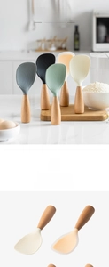 Macro detail of heat-resistant non-stick silicone rice spoons with smooth wooden handles