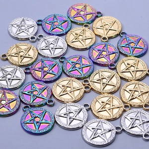 Close-up of star-patterned pendants in gold, silver, and rainbow steel finishes