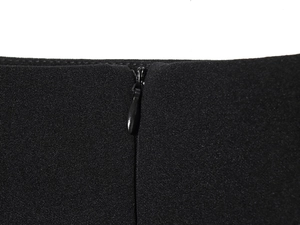 Close-up of high-quality invisible zipper on black short sleeve top fabric