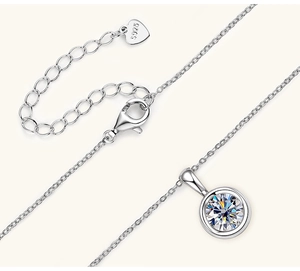 Macro detail of S925 sterling silver chain with lobster clasp and round moissanite pendant
