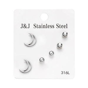 Detail showing set of 3 pairs stainless steel stud earrings with crescent moon and zircon
