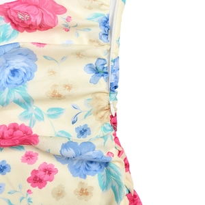 Close-up of floral print dress featuring pink roses and a side invisible zipper closure