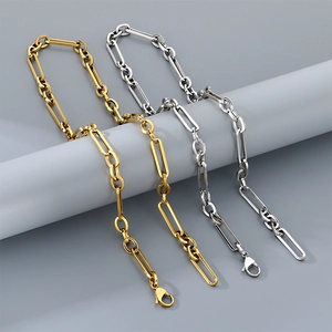 Detail of silver and gold square wire O-chains with lobster clasps on display stands