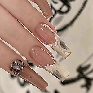 Handmade brown ink wash press-on nails with silver trim and sparkling rhinestones