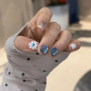 Blue cat eye press-on nails with 3D daisy flowers and pearl accents for women