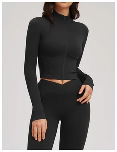 Detailed view of women's black slim-fit yoga jacket with zip collar and high-waist leggings