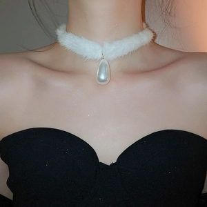 Detail of soft white faux fur choker featuring a large teardrop pearl pendant