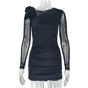 Detail of black slim-fit mini dress with 3D rose and sheer mesh long sleeves