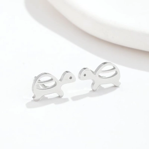 Minimalist silver sea turtle stud earrings featuring a polished metallic finish for women
