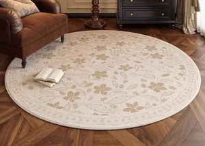 Detail of vintage floral round rug with cream and brown patterns on dark wood floor