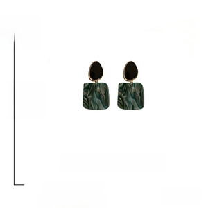 Detail of green acrylic square earrings showing 5.6cm length and 14.2g weight specifications