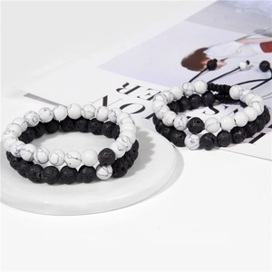 Detail of volcanic stone and turquoise beaded bracelets set on a minimalist display