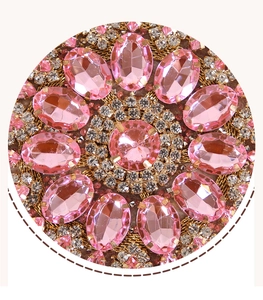 Macro detail of sunflower dinner bag featuring pink gems and sparkling rhinestones