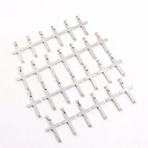 Stainless steel initial cross pendant set in silver finish on white background