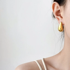 Minimalist large golden teardrop earrings with high-polished mirror finish for women