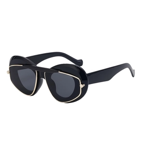 Chic black oval sunglasses with thick frames and golden metal bridge accents