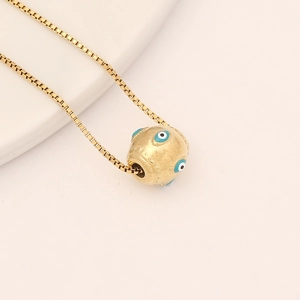 Golden box chain necklace with evil eye bead pendant featuring blue and white eye patterns