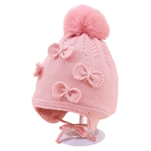 Pink winter knit baby hat with earflaps, large faux fur pompom and decorative bows