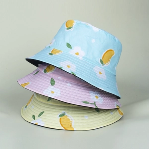 Floral print sun bucket hats in blue, purple, and yellow with fresh mango patterns