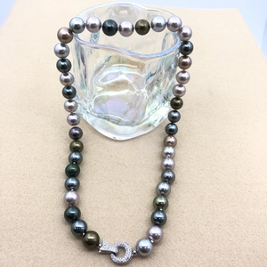 Detail of multi-color Tahitian style pearl necklace with crystal encrusted silver clasp