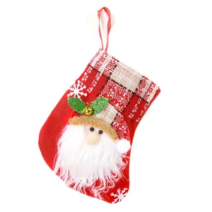 Red Christmas stocking with Santa Claus motif and plaid cuff for holiday tree decoration