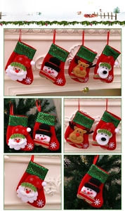 Detail of Christmas stockings with 3D Santa and Reindeer on fireplace and tree