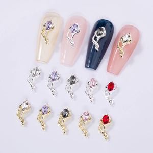 Detailed view of marquise-cut rhinestones set in gold and silver spiral nail charms