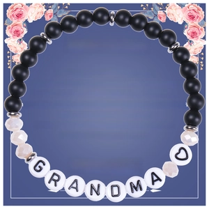 Detail of Grandma beaded bracelet with matte black stones and floral gift card