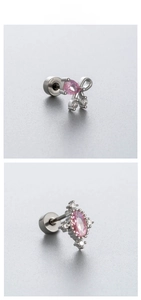 Macro detail of screw-back earrings with pink zircon bow and teardrop crystal design