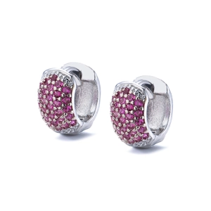 Close-up of pavé set pink zircon stones on silver hoops with macro detail and shine