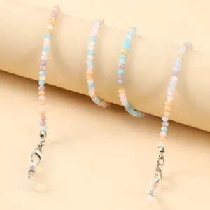 Macro detail of colorful crystal beaded eyeglass chain with silver lobster clasps