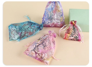 Detail of coral pattern drawstring organza bags for jewelry and gift packaging