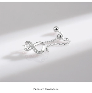 Macro shot of adjustable sterling silver infinity ring with micro-set zircons and chain