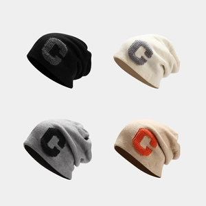 Set of four knitted C-letter beanies in black, beige, gray, and khaki colors
