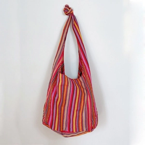 Ethnic bohemian woven tote bag with colorful vertical stripes and broad knot shoulder strap