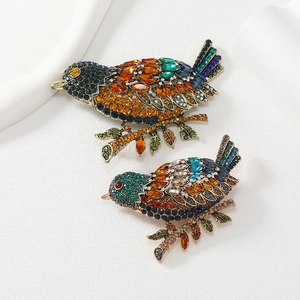 Exquisite vintage magpie brooches with colorful rhinestones on a bronze metal base