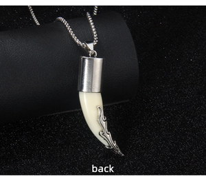 Detail view showing back of the wolf tooth pendant on a silver beaded chain