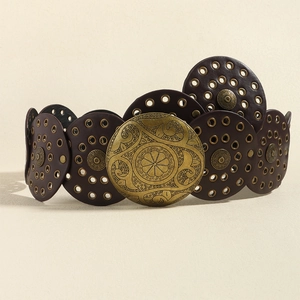 Detail of a brown leather waist belt featuring brass eyelets and embossed metal discs