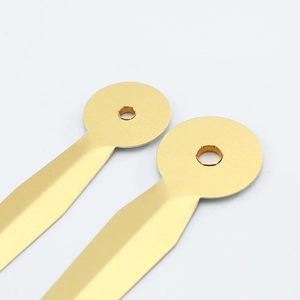 Golden aluminum quartz clock hands with brushed metal texture and precision mounting holes