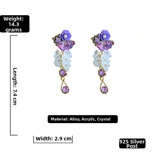 Detail of purple bohemian floral earrings with S925 silver needles and crystal heart pendant